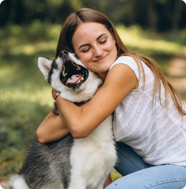 Woman hugging a husky dog